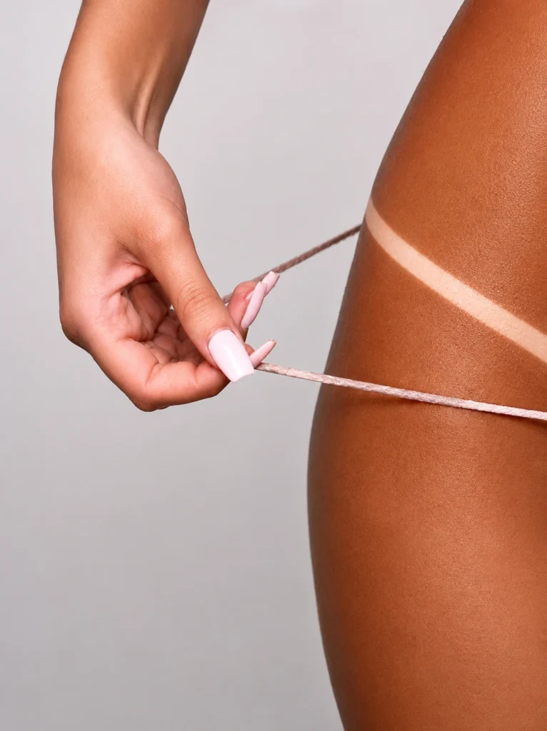Professional Spray Tan Tan Line Definition | Bronzed By Sabrina Close-up of a professional spray tan showing crisp tan line definition and even bronzed colour